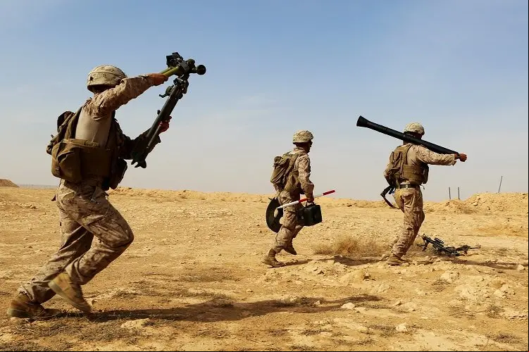 U.S. Marines with Weapons Company, 1st Battalion, 7th Marine Regiment, Special Purpose Marine Air-Ground Task Force--Crisis Response--Central Command, rush with their weapons system as they conduct live-fire training on the new M252A2 81mm mortar system at Al Asad Air Base, Iraq, Oct. 24, 2015. The training allowed the Marines, who are charged with providing security of Al Asad, an opportunity to hone their tactics, techniques and procedures in employment of the system, further reinforcing their ability to provide protection to their coalition and Iraqi Security Force partners as part of the Combined t Task Force – Operation Inherent Resolve’s building partner capacity mission. (U.S. Marine Corps photo by Sgt. Owen Kimbrel/Released)